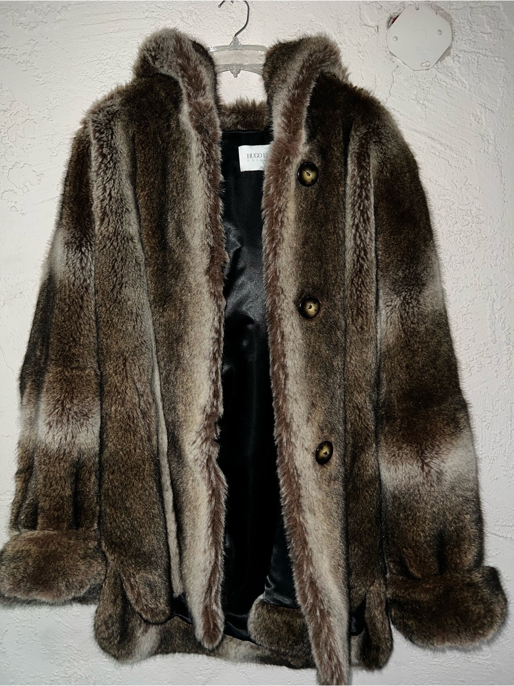 Hugo Buscati faux fur coat features a rich brown and beige striped pattern